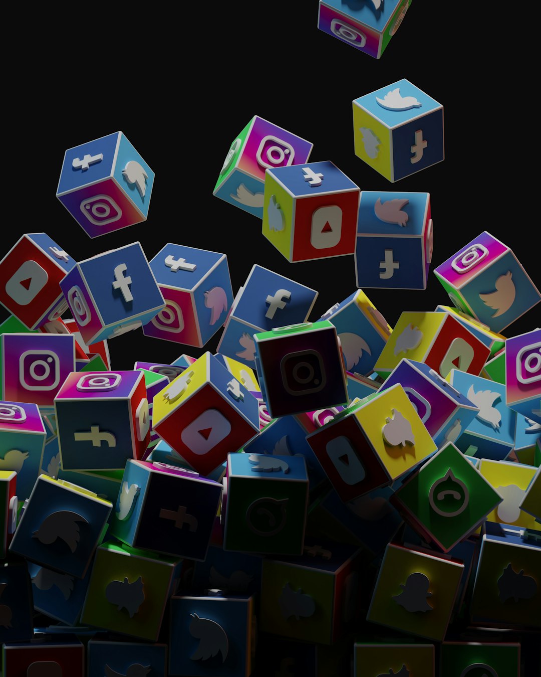 a-pile-of-colorful-cubes-with-social-icons-flying-out-of-them-nmz3sdzsyio